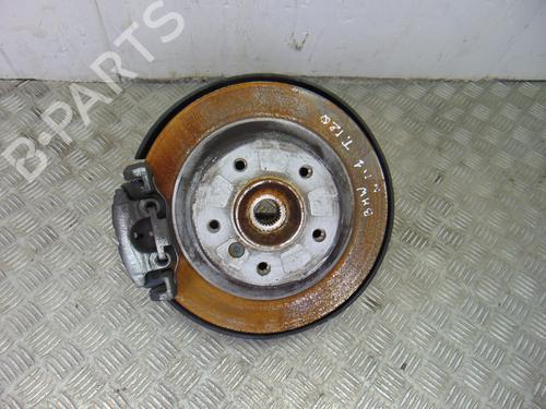 Used Left rear steering knuckle BMW 1 (E87) 118 d (143 hp) 11215564