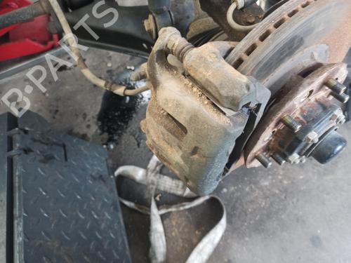 Used Left front brake caliper NISSAN PICK UP (D22) 2.5 Di 4WD (133 hp) 26559614