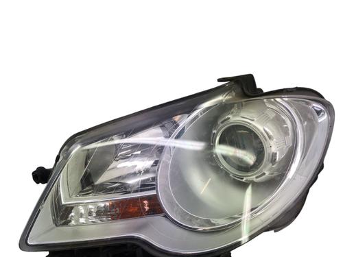Used Left headlight VW TOURAN (1T1, 1T2) 1.9 TDI (105 hp) 31644079