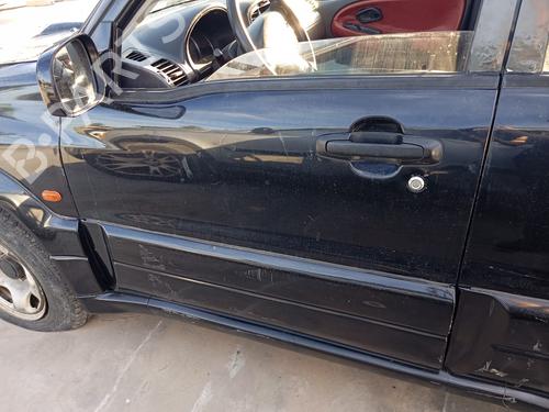 Używane Klamka zewnętrzna drzwi przednich lewych SUZUKI GRAND VITARA I (FT, HT) 2.0 HDI 110 16V 4x4 (SQ420D, TD83V) (109 hp) 22598325