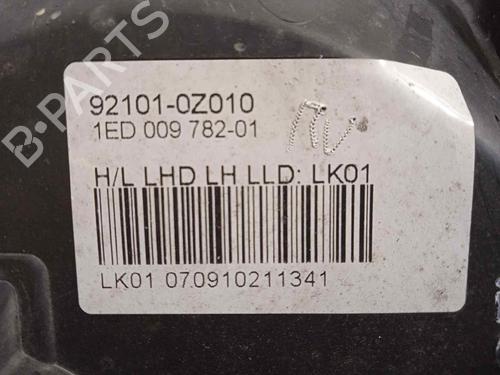 Left headlight KIA SPORTAGE II (JE_, KM_) 2.0 i 16V | BP16767154C28