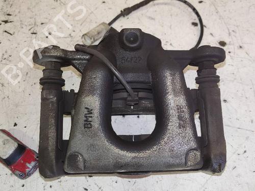 Used Left front brake caliper BMW 1 (E81) 116 d (116 hp) 12625766