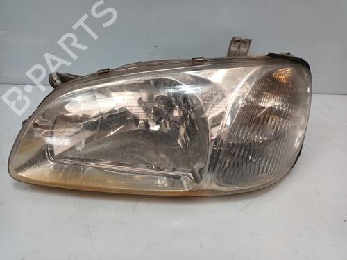 Used Left headlight KIA CARNIVAL I (UP) 2.9 TDi (126 hp) 19545398