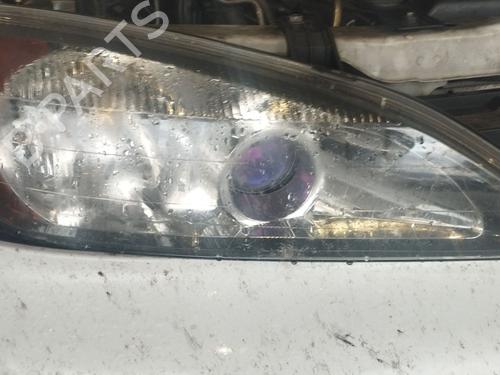Used Right headlight NISSAN PRIMERA (P11) 2.0 TD (90 hp) 31309412