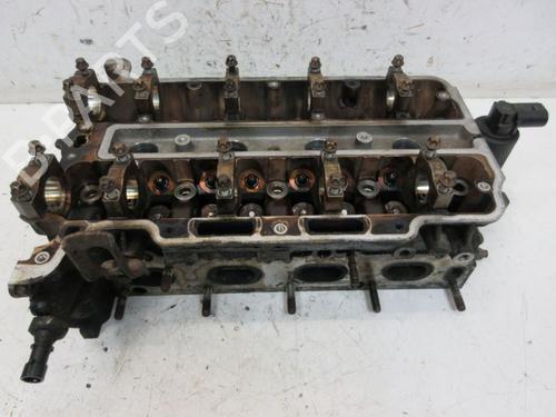 Used Cylinder head OPEL ASTRA H Estate (A04) 1.4 (L35) (90 hp) 19289711