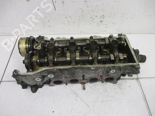 Used Cylinder head NISSAN MICRA III (K12) 1.2 16V (65 hp) 18791326
