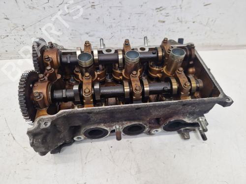 Used Cylinder head OPEL AGILA (B) (H08) 1.0 (F68) (65 hp) 25602377