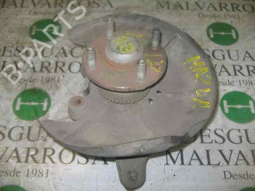 Used Left rear steering knuckle MAZDA 323 C V (BA) [1994-2001]  3774536