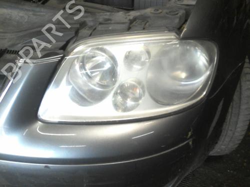 Used Left headlight VW TOURAN (1T1, 1T2) 1.9 TDI (100 hp) 21976629