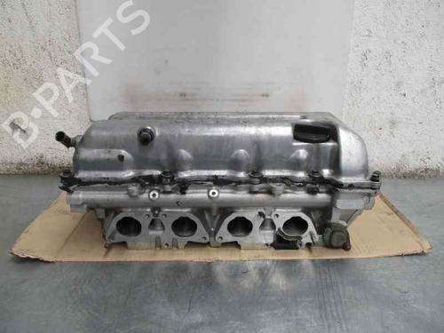 Used Cylinder head NISSAN PRIMERA (P11) 2.0 16V (131 hp) 10979011