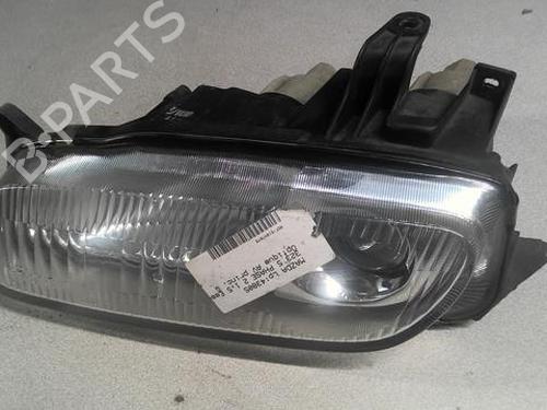 Used Left headlight MAZDA 323 P V (BA) 1.5 16V (88 hp) 22003438