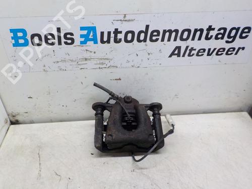 Used Left front brake caliper BMW 1 (E81) 116 i (122 hp) 23006821