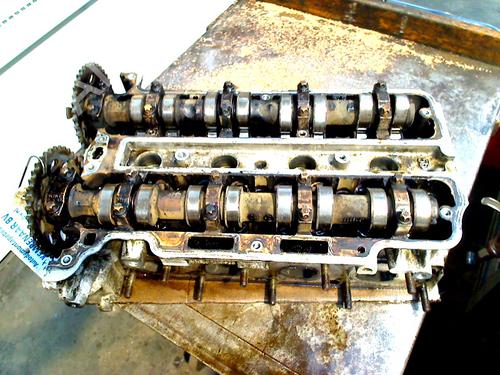 Used Cylinder head OPEL CORSA D (S07) 1.2 (L08, L68) (80 hp) 30497303