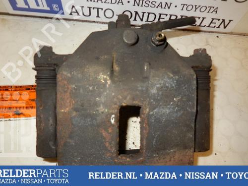 Used Left front brake caliper NISSAN ALMERA TINO (V10) 2.2 dCi (115 hp) 22135143