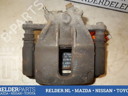 Used Right front brake caliper NISSAN MICRA III (K12) 1.0 16V (65 hp) 22135571