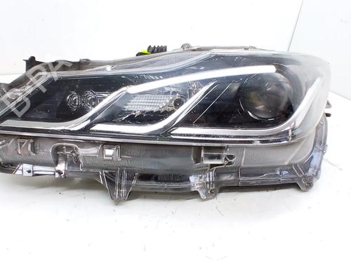 Used Left headlight Left headlight TOYOTA COROLLA Estate (_E21_) 1.8 Hybrid (ZWE211W) (122 hp) 33771695 33771695