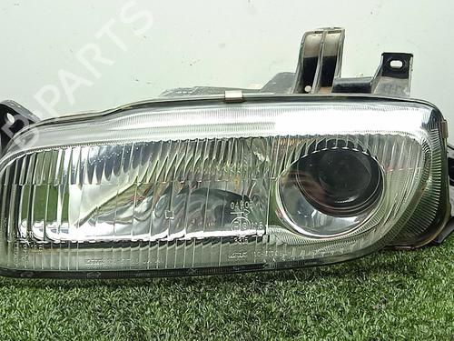 Used Left headlight MAZDA 323 F V (BA) 1.5 16V (BA11) (88 hp) 32145221
