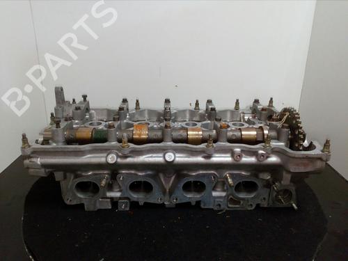 Used Cylinder head NISSAN PRIMERA Hatchback (P10) [1990-1996]  10972390