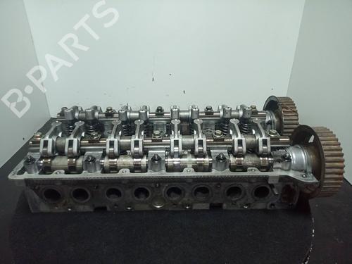 Used Cylinder head KIA CARNIVAL I (UP) 2.9 TDi (126 hp) 10972741