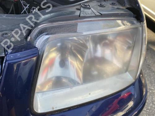 Used Left headlight VW POLO (6N2) 1.4 16V (75 hp) 25740037