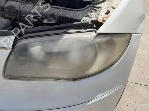 Used Left headlight BMW 1 (E87) 118 d (143 hp) 33049042