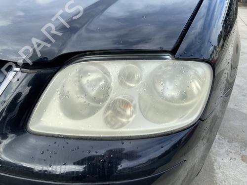 Used Left headlight VW TOURAN (1T1, 1T2) 1.9 TDI (105 hp) 28493456
