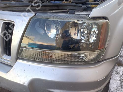 Used Left headlight JEEP GRAND CHEROKEE II (WJ, WG) 2.7 CRD 4x4 (163 hp) 29594527