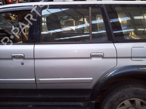 Used Left rear door MITSUBISHI PAJERO SPORT I (K7_, K9_) 2.5 TD (K94W, K74T) (115 hp) 8600073