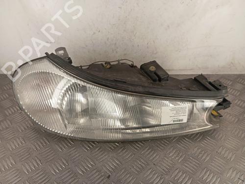Used Right headlight FORD MONDEO II (BAP) 1.8 i (115 hp) 31660431