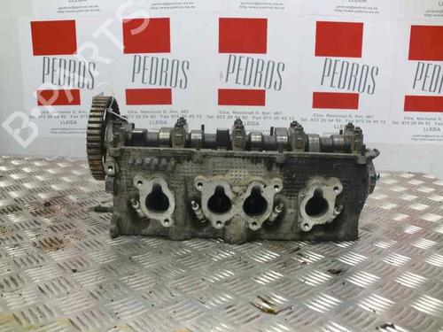 Used Cylinder head VW GOLF III (1H1) 1.8 (75 hp) 10977018
