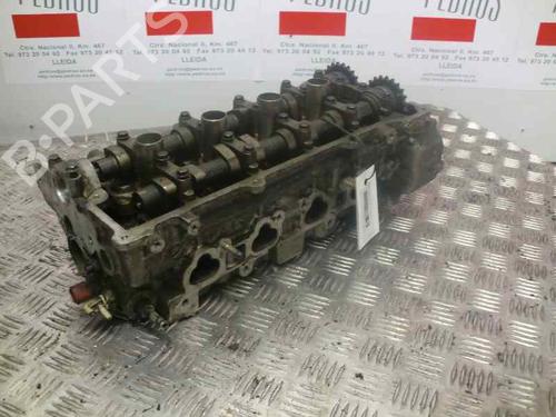 Used Cylinder head NISSAN PRIMERA Hatchback (P11) 1.6 16V (99 hp) 10977004