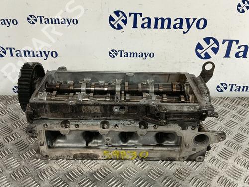 Used Cylinder head VW TOURAN (5T1) 2.0 TDI (150 hp) 31338274