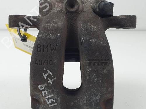 Used Left rear brake caliper BMW 1 (E87) 118 i (129 hp) 27624829