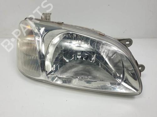 Used Right headlight KIA CARNIVAL I (UP) 2.9 TDi (126 hp) 12380697