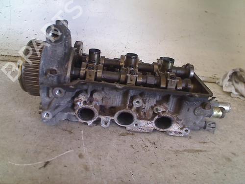 Used Cylinder head Cylinder head DAIHATSU CUORE VI (L251, L250_, L260_) 1.0 (58 hp) 34668259 34668259
